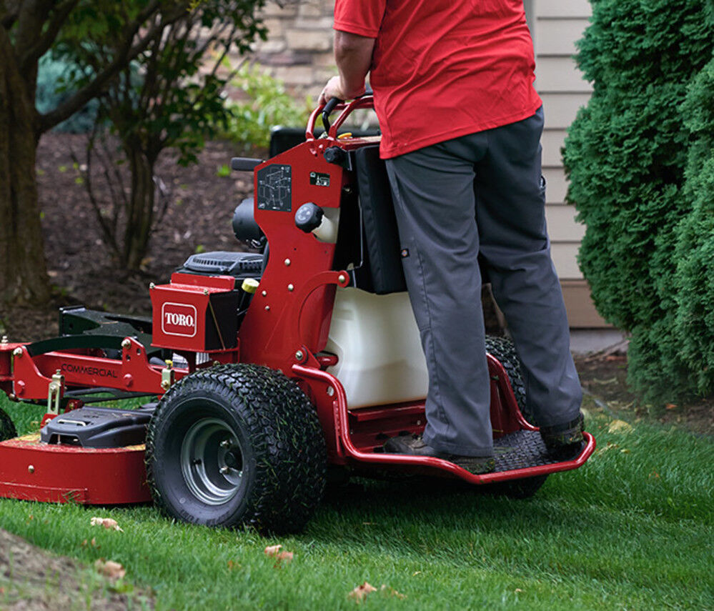 Walk behind mower top stand on attachment