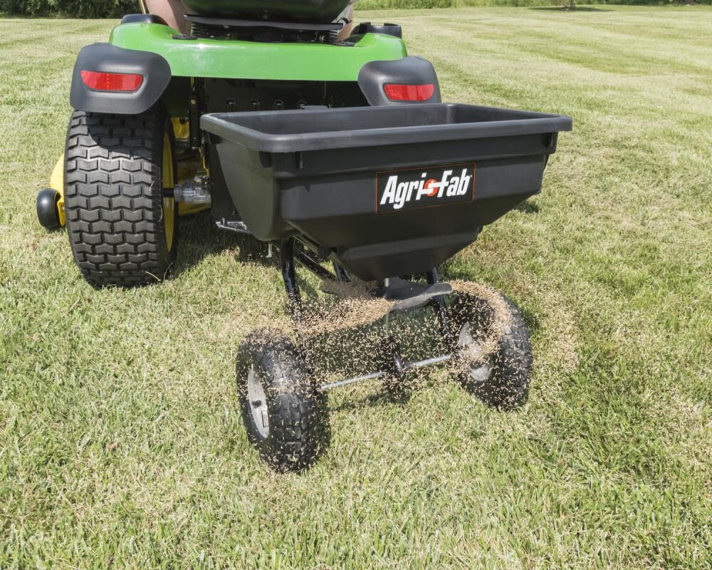 Yardworks 85lb Capacity Tow Behind Broadcast Spreader – Large Poly Hopper Fertilizer Trailer