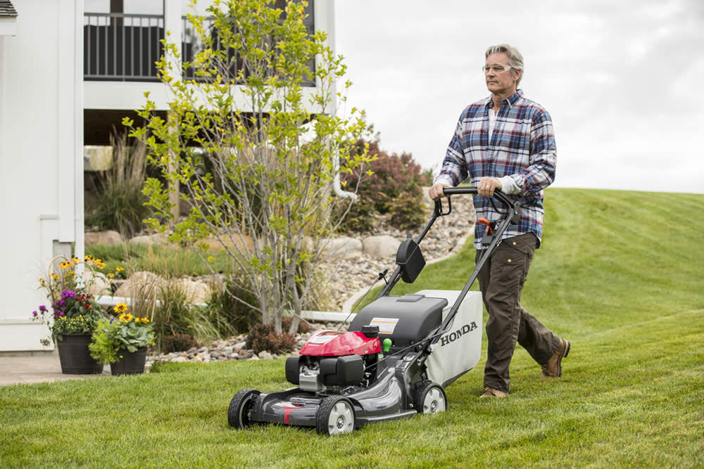 Self propelled electric store start gas lawn mower