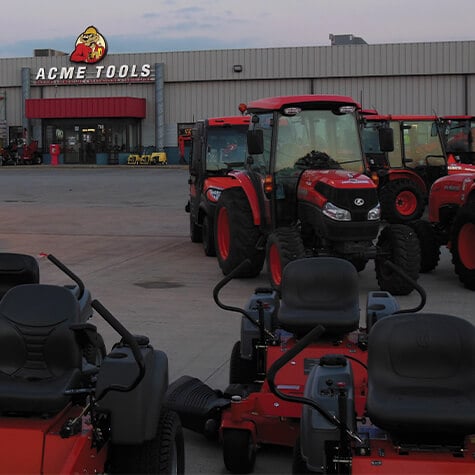 Lawn mowers and tractors outside of the Minot, ND Acme Tools store