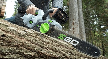 Ego chainsaw cutting a log
